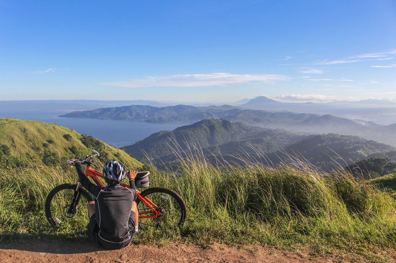 Man on mountain bike with mountain view
