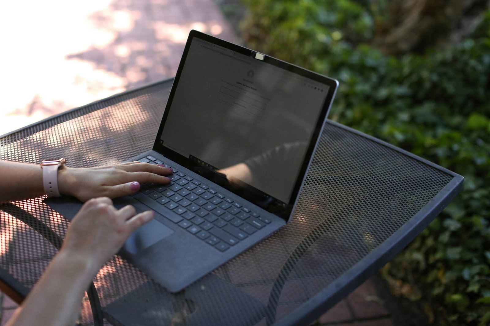 A laptop with the best online faxing software downloaded sitting on a table.