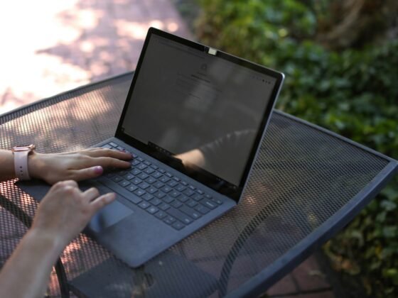 A laptop with the best online faxing software downloaded sitting on a table.